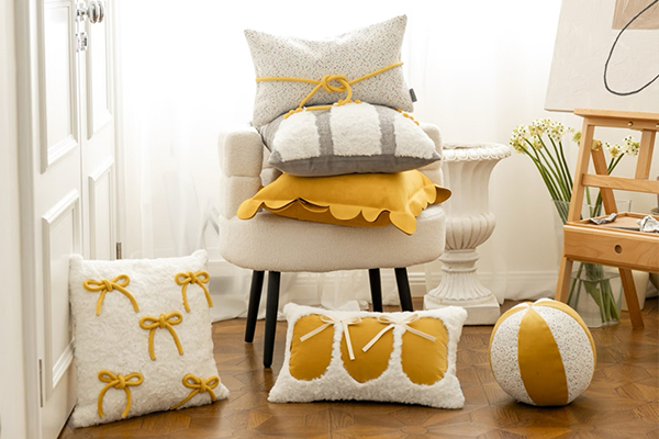 An elegant bow pillow on a bedroom chair