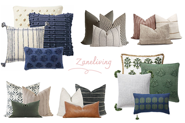 a set of colorful throw pillows arranged on a neutral sofa