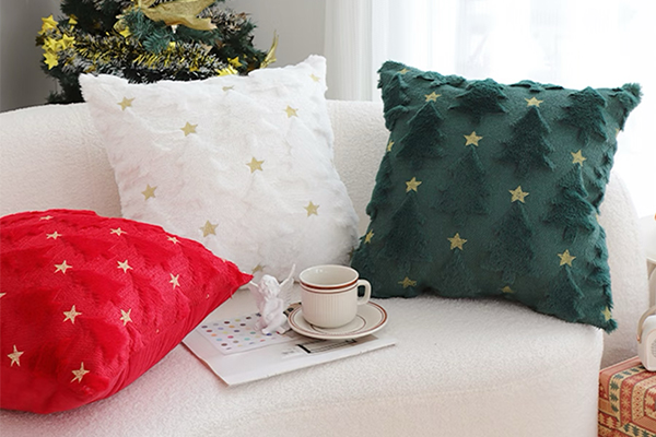A stylish living room decorated for Christmas in blue and gold colors.