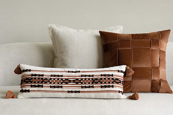 a well-styled sofa with a variety of throw pillows